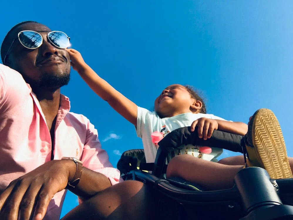 a child touching their parent’s face