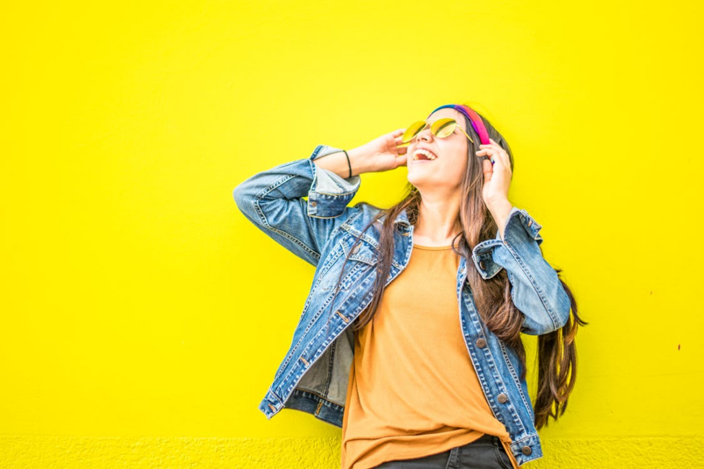 a person near a yellow wall