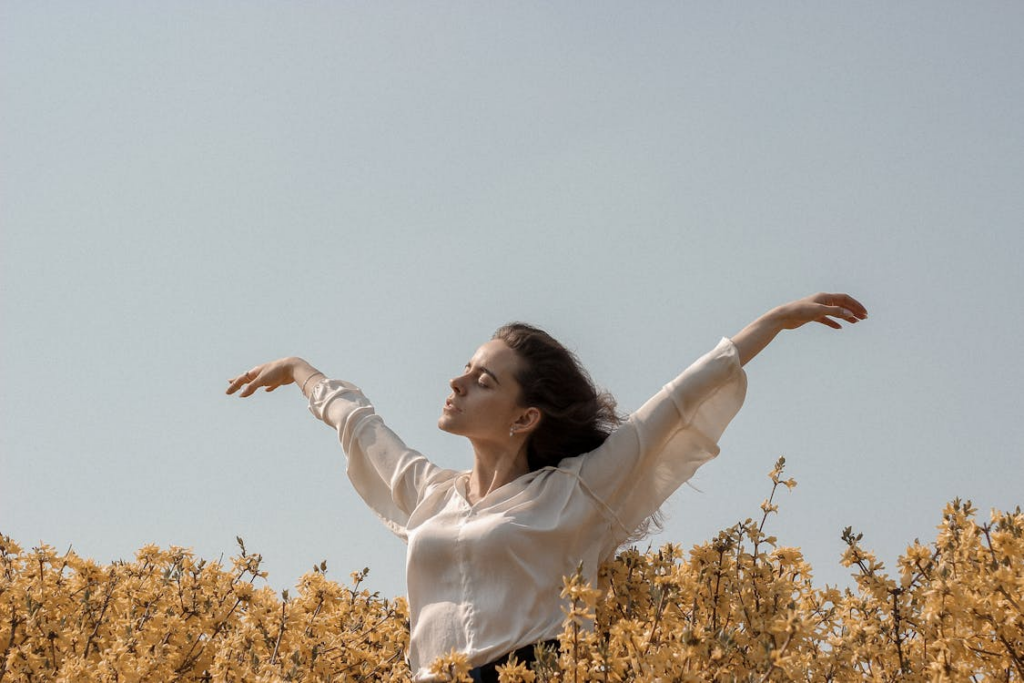 a woman standing in sunlight