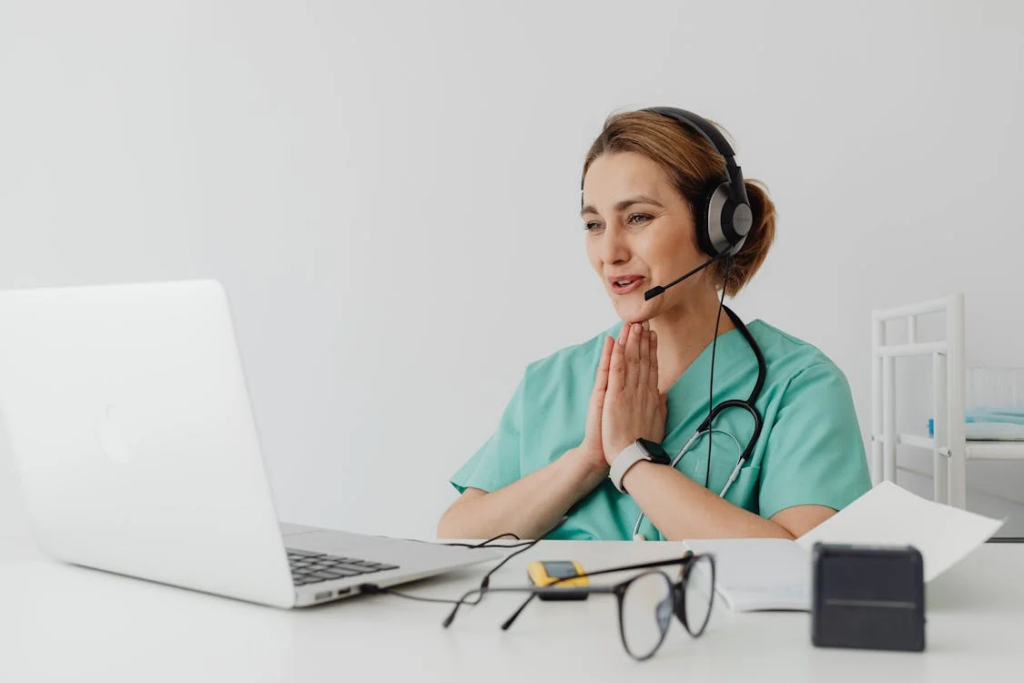 a provider smiling at the webcam