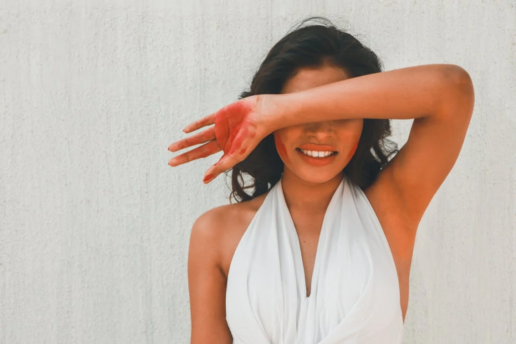 a person covering their eyes