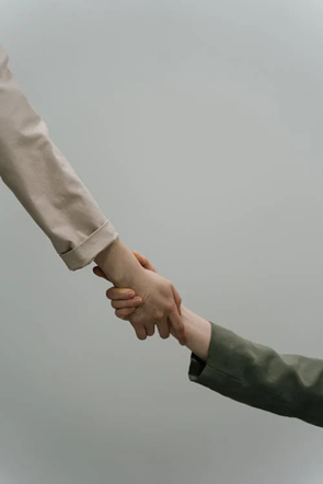 a hand helping another
