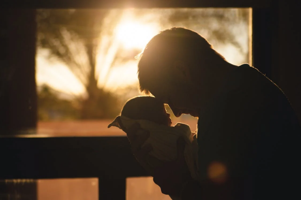 a person holding a child