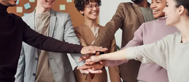 a group holding each other's hands