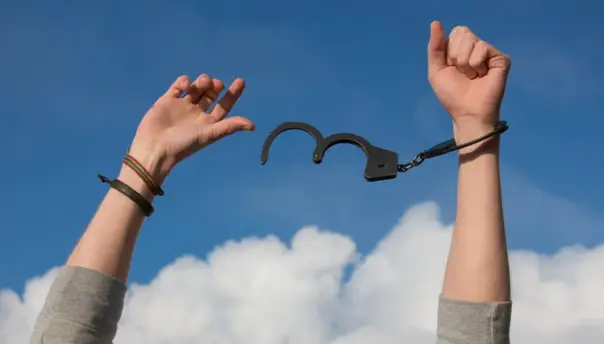 A person breaking free from restraints