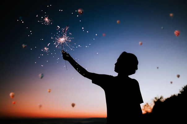 A person holding a sparkler