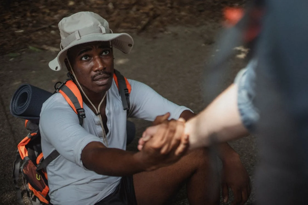 a person helping someone up