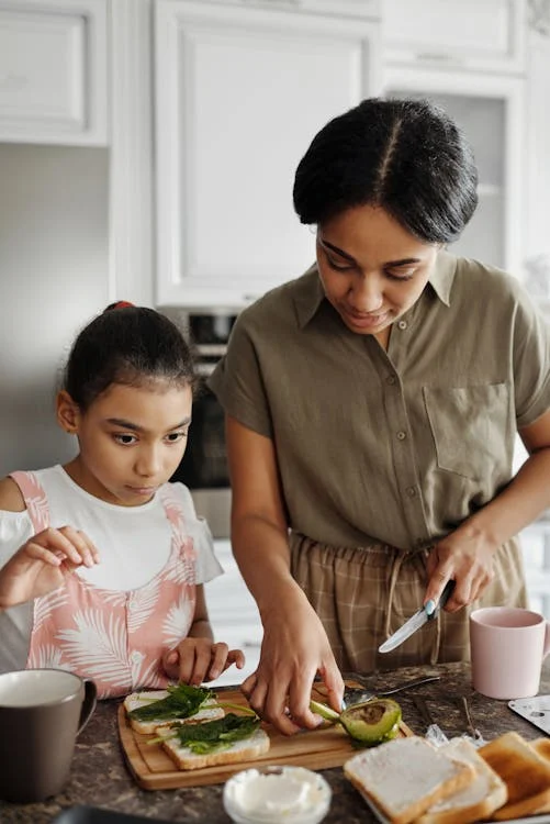 a person cooking with their children