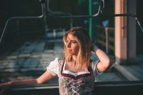 a woman facing the sunlight 