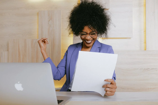 a woman holding a paper