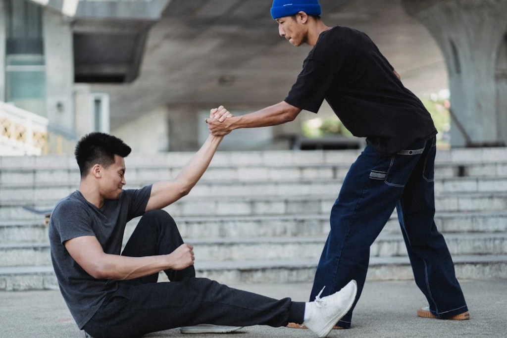 a person helping another up