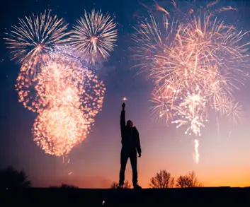 A person lighting fireworks