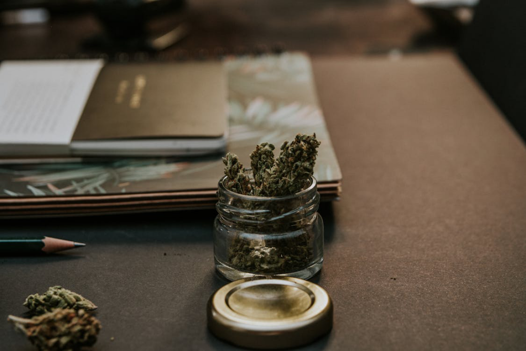 Close-up of kush in a glass container,