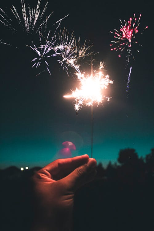 A person holding a sparkler