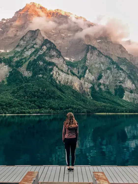 A woman looking at the mountains