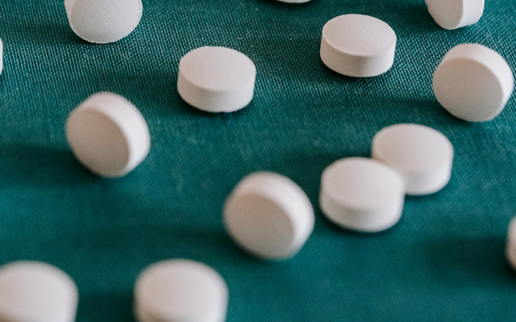  A variety of pills scattered on a surface