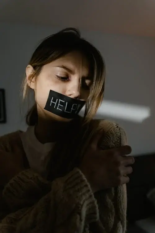 A person with tape on their mouth